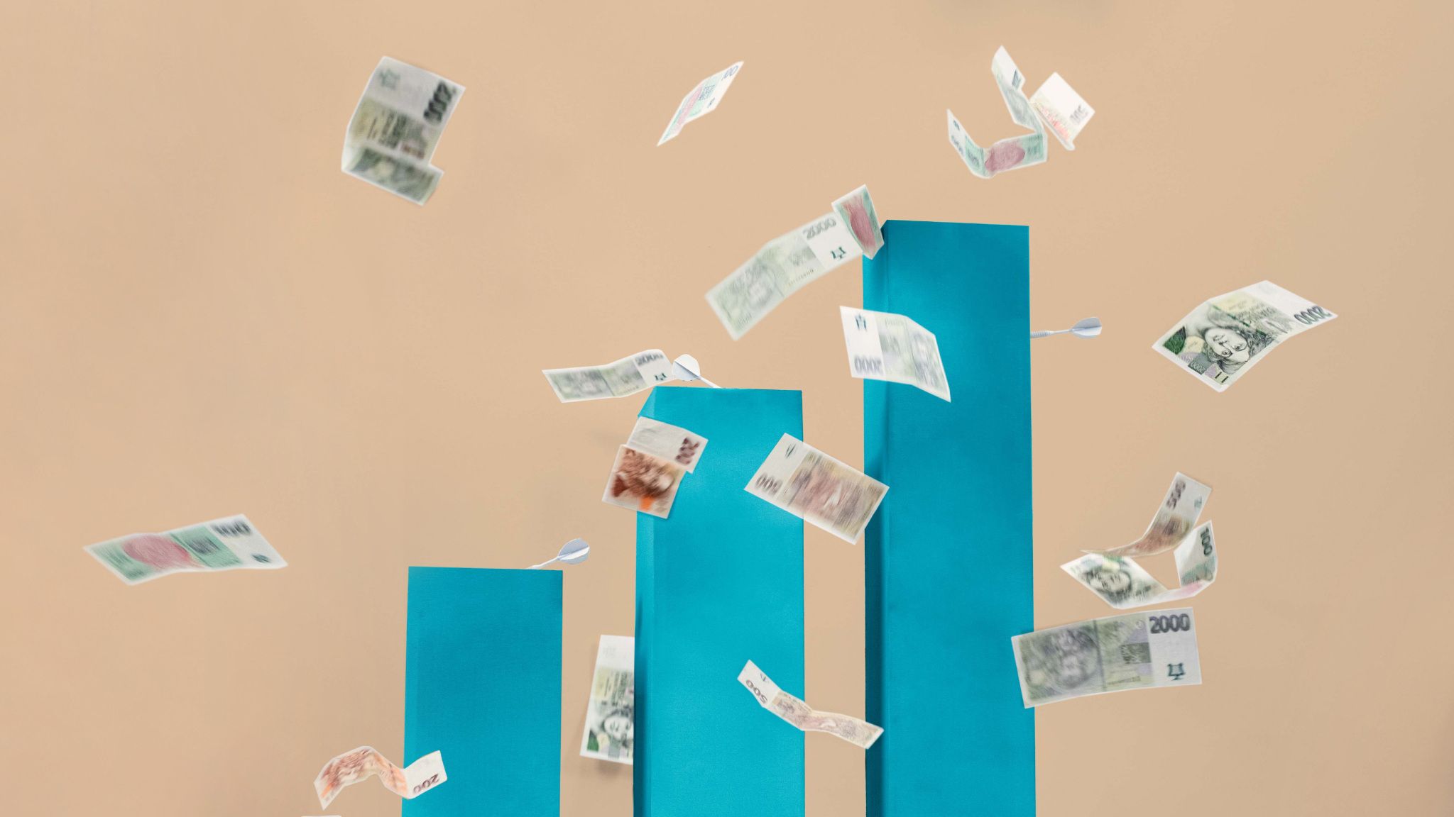 Czech banknotes flying around blue bar chart |Raynet CRM